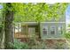 View of the home from backyard showcasing a covered porch at 1408 South St, Durham, NC 27707