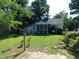 Charming home featuring a well-maintained front lawn and a screened porch for outdoor enjoyment at 204 Southland Dr, Zebulon, NC 27597