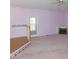 Spacious living room with pink walls, a fireplace and a ceiling fan at 204 Southland Dr, Zebulon, NC 27597