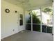 Screened porch with ceiling fan overlooking the backyard at 204 Southland Dr, Zebulon, NC 27597