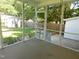 View from a screened porch that overlooks the fenced backyard with storage shed at 204 Southland Dr, Zebulon, NC 27597