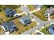 An elevated view of the house in the neighborhood shows the surrounding landscape at 300 Ledge Manor Dr, Holly Springs, NC 27540