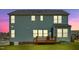 View of the rear exterior featuring a wood deck with access to the backyard at 300 Ledge Manor Dr, Holly Springs, NC 27540