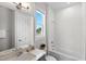 Well-lit bathroom features white subway tile, a soaking tub, and a gray vanity with a white countertop at 300 Ledge Manor Dr, Holly Springs, NC 27540