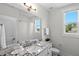 Bright bathroom featuring granite countertop, white cabinets, and subway tiled shower at 300 Ledge Manor Dr, Holly Springs, NC 27540