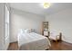 Bright bedroom with hardwood floors, a twin bed and a reading nook at 300 Ledge Manor Dr, Holly Springs, NC 27540