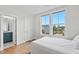 Bedroom with hardwood floors, natural light and a ensuite bathroom at 300 Ledge Manor Dr, Holly Springs, NC 27540