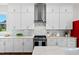 Modern kitchen showcases white cabinets, stainless appliances, and stylish backsplash at 300 Ledge Manor Dr, Holly Springs, NC 27540