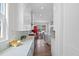 Well-lit kitchen featuring white cabinetry, quartz countertops, and stainless-steel appliances at 300 Ledge Manor Dr, Holly Springs, NC 27540