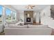 Inviting living room with a stone fireplace, hardwood floors, and a comfortable sectional sofa at 300 Ledge Manor Dr, Holly Springs, NC 27540
