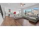 Open-concept living space showcases a kitchen and comfortable seating area with lots of natural light at 300 Ledge Manor Dr, Holly Springs, NC 27540