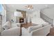 Inviting living room features a cozy fireplace with stone surround and hardwood floors at 300 Ledge Manor Dr, Holly Springs, NC 27540