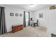 Cozy bedroom or office with a workspace, storage, carpet floors, and art at 4 Galaxy Ct, Durham, NC 27705