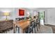 Dining room features a fireplace and modern art piece, with seating for eight at 4 Galaxy Ct, Durham, NC 27705