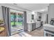 Modern kitchen with stainless steel appliances and sliding glass doors to the backyard deck at 4 Galaxy Ct, Durham, NC 27705