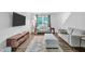 Cozy living room offers wood floors, neutral paint, TV, and comfortable seating at 4 Galaxy Ct, Durham, NC 27705