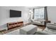 Cozy living room offers wood floors, neutral paint, TV, and comfortable seating at 4 Galaxy Ct, Durham, NC 27705