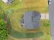 An aerial view shows a well-manicured lawn surrounding a home with a dark roof at 4014 White Kestrel Dr, Raleigh, NC 27616