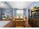 Bright dining room offering hardwood floors and charming light fixture near playroom area at 4014 White Kestrel Dr, Raleigh, NC 27616