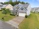 Two-story home featuring a stone facade, well-manicured lawn and a two car garage for convenience at 4014 White Kestrel Dr, Raleigh, NC 27616