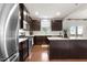 Beautiful kitchen with stainless steel appliances and dark wood cabinets with white countertops at 4014 White Kestrel Dr, Raleigh, NC 27616