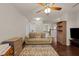 Cozy Gathering room with a ceiling fan, hardwood floors, and comfortable seating arrangement at 4014 White Kestrel Dr, Raleigh, NC 27616