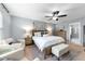 Relaxing primary bedroom showcasing a ceiling fan, a king bed, and neutral colors at 4014 White Kestrel Dr, Raleigh, NC 27616