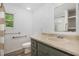 Traditional bathroom features a new toilet, a single sink vanity, and safety bars at 5840 Fayetteville Rd, Raleigh, NC 27603
