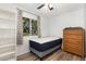 Cozy bedroom featuring a new mattress, wood floors, dresser, and plenty of natural light at 5840 Fayetteville Rd, Raleigh, NC 27603