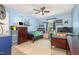 Charming ' bedroom with two beds, ceiling fan, and aviation-themed wall decor at 5840 Fayetteville Rd, Raleigh, NC 27603