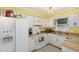 Well-lit kitchen with white appliances, and tile flooring at 5840 Fayetteville Rd, Raleigh, NC 27603