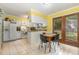 Charming kitchen features lots of natural light, white cabinets, and tile floor at 5840 Fayetteville Rd, Raleigh, NC 27603