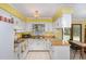Bright kitchen with white cabinetry, and ample counter space at 5840 Fayetteville Rd, Raleigh, NC 27603