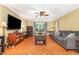 Cozy living room featuring a brick fireplace and bright lighting at 5840 Fayetteville Rd, Raleigh, NC 27603