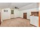 Spacious living room features neutral carpet, ample natural light, and ceiling fan at 5840 Fayetteville Rd, Raleigh, NC 27603