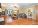 Comfortable living room with a ceiling fan and parquet floors at 5840 Fayetteville Rd, Raleigh, NC 27603