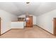 Cozy living room features neutral carpet, built-in shelves, and ample natural light at 5840 Fayetteville Rd, Raleigh, NC 27603