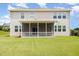 The backyard features a screened porch, green grass, and a two-story house at 812 Teal Lake Dr, Holly Springs, NC 27540