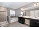 Stunning bathroom features a luxurious tub, a glass-enclosed shower, and elegant fixtures for a spa-like experience at 812 Teal Lake Dr, Holly Springs, NC 27540