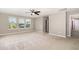 Comfortable bedroom featuring a ceiling fan, natural light, and neutral colors, creating a relaxing and serene retreat at 812 Teal Lake Dr, Holly Springs, NC 27540