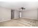 Large bedroom with neutral paint, carpet flooring, ceiling fan, and ample lighting for a bright and airy feel at 812 Teal Lake Dr, Holly Springs, NC 27540