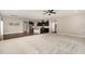 Open-concept living space featuring dark hardwood floors and view of the kitchen at 812 Teal Lake Dr, Holly Springs, NC 27540