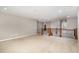 Expansive loft area boasts neutral paint, plush carpeting, and an elegant railing, creating an inviting open space at 812 Teal Lake Dr, Holly Springs, NC 27540
