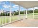 Screened porch with view of the backyard and adjacent homes at 812 Teal Lake Dr, Holly Springs, NC 27540