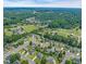 Gorgeous aerial view of a well-maintained community surrounded by lush greenery at 104 Roscommon Ln, Clayton, NC 27520