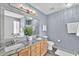 Modern bathroom with granite countertops, double sinks, and stylish fixtures at 104 Roscommon Ln, Clayton, NC 27520