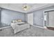 Serene bedroom with carpet, neutral walls, ceiling fan, and closet space at 104 Roscommon Ln, Clayton, NC 27520