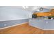 Eat-in kitchen features hardwood floors, granite countertops, and modern appliances at 104 Roscommon Ln, Clayton, NC 27520