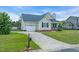 Well-maintained one story home with attached garage, long driveway and attractive landscaping at 104 Roscommon Ln, Clayton, NC 27520