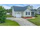 Well-kept house with attached garage, tidy landscaping and long driveway at 104 Roscommon Ln, Clayton, NC 27520